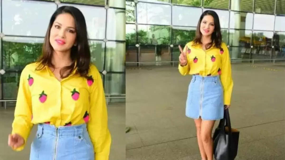 Sunny Leone Hot Photos: एयरपोर्ट पर पीली शर्ट और ब्लू डेनिम स्कर्ट मे पोज देती दिखाई दी सनी लिओनी